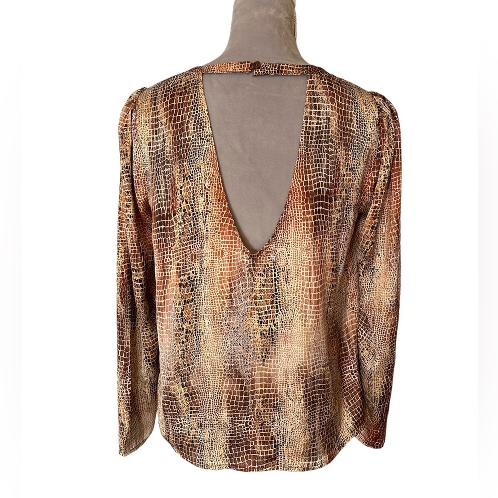 Animal print blouse with cut out in back. Silky feel, loose fit. Size S.